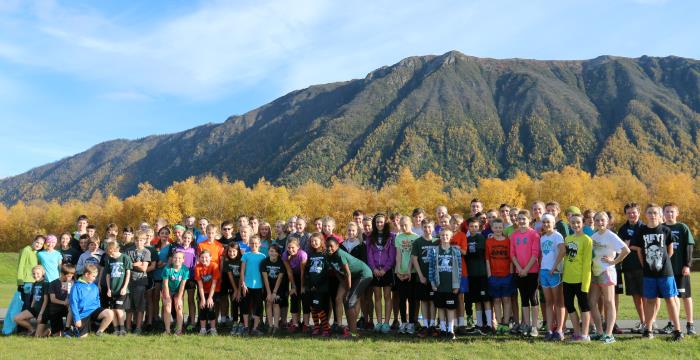 students in front of mountains 