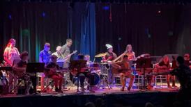 Students on stage for school wide rock band performance