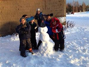 kids building a snowman 