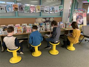 children sitting in library